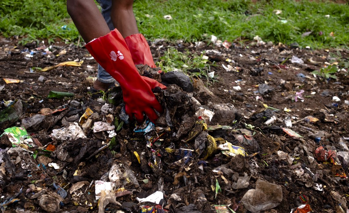 CleanSweep volunteers clear mixed waste using basic protective gear. Image Credit: CleanSweep
